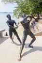 Public sculpture of fishermen landing a sailfish