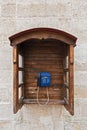 Public semi-open wooden telephone in a street in the old town of Lviv, Ukraine