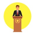 Public speaker speaking to microphones