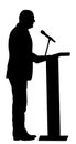 Public speaker standing on podium silhouette. Businessman speaking with public. Talking on microphone.