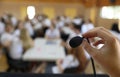 Public Speaking Fear. Person About To Speak Into A Small Microphone In Front Of A Large Crowd