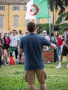 Public Speaking in the Square during a Political Demonstration with Crowd and Algerian Flag