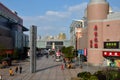 Public square with restaurants, shops and sculpture outside Shanghai China railway station