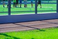 Public stadium for sports - team of soccer players on a football field, running track closeup and green grass Royalty Free Stock Photo