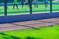 Public stadium for sports - team of soccer players on a football field, running track closeup and green grass Royalty Free Stock Photo