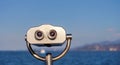Public stationary binocular on sea shore