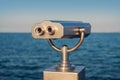 Public stationary binocular on sea shore