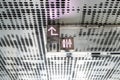 Public Steel or iron signboard of toilet with male and female symbol hanging signs on ceiling