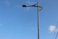 Public street lamp against blue skies at the afternoon