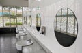 Public toilet counter top complete with basins, water taps, and face mirror. Royalty Free Stock Photo