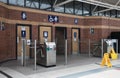 Public toilet restrooms in a station. Turnstile and fee