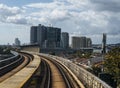 Public train track with view of skyscrappers. Transportation concept. outdoor. Royalty Free Stock Photo