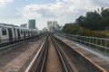 Public train track with view of skyscrappers. Transportation concept. outdoor. Royalty Free Stock Photo