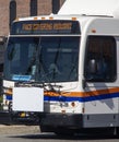 Public transit bus with a digital sign stating Face Covering Required