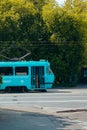 Public transport blue tram with opening doors with passengers inside. Moscow, Russia, June 2020