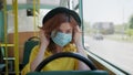 Public transport, woman complies with new safety standards in public place and wears medical protective mask on her face