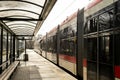 Public transport scene in Gdansk. Empty transport stop. No people Tram arrives at the tram stop. Transport city traffic