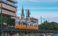 Public transportation in Budapest - tram on the tracks on the Danube Promenade with blue sky in the background