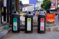 Public trash cans categorized by type of organic, plastic and glass waste