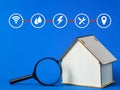 Public utilities icons with house miniature and magnifying glass.