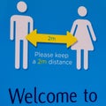 Public Warning sign Advicing People To Keep 2m Apart During Covid-19