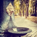 Public Water Fountain in park in the form of Lion head Royalty Free Stock Photo