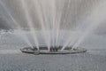 A public water fountain spray structure giving out enormous jets of water