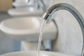 Public water taps in the school`s toilet Royalty Free Stock Photo