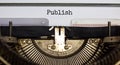 Publish symbol. The word `publish` typed on retro typewriter. Business, publish concept. Beautiful background Royalty Free Stock Photo