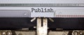 Publish symbol. The word `publish` typed on retro typewriter. Business, publish concept. Beautiful background Royalty Free Stock Photo