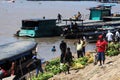 pucallpa peru, ucayali river with boats transporting banana fruits and workers unloading from the jungle to the port Royalty Free Stock Photo
