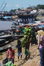 pucallpa peru, ucayali river with boats transporting banana fruits and workers