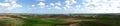 Pucka Bay green field and blue cloudy sky panorama Royalty Free Stock Photo