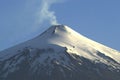 snowy villarica volcano in eruption in the city of pucon chile Royalty Free Stock Photo