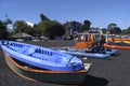 Pucon city with the peculiar black volcanic sand with Villarica lake and artisanal fishing boats in Chile-May 2017