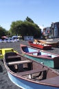 Pucon city with the peculiar black volcanic sand with Villarica lake and artisanal fishing boats in Chile-