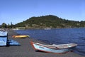 Pucon city with the peculiar black volcanic sand with Villarica lake and artisanal fishing boats in Chile-