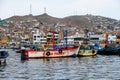 Pucusana, Peru -: views of peruvian fishermen boats and houses in Pucusana village in a cloudy morning in tourist Royalty Free Stock Photo