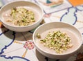 pudding blancmange decorated with almond and pistachio