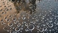 puddle with bubbles and water circles during heavy