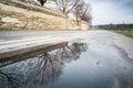 Puddle of rainwater on the Vistula boulevard in Krakow Royalty Free Stock Photo