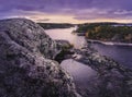 Puddle on a rock in the foreground. Purple colors. Nordic landscape