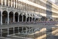 Puddle which reflects Procuratie Vecchie in Piazza San Marco in Venice
