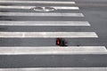 Puddles on a pedestrian crossing seen semaphore signal reflection