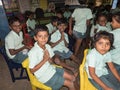 Happy children friends classmates smiling with hands joint gesture at the school in classroom. School kids enjoying friendship