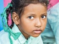 Portait of girl pupil looking serious in classroom