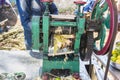 Documentary editorial. PUDUCHERY, PONDICHERY, TAMIL NADU, INDIA - March circa, 2018. Unidentified man Worker Extract Cane Juice Royalty Free Stock Photo