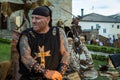 Portrait of tattooed man dressed as medieval blacksmith in Medieval Market of Puebla de Sanabria. Zamora, Spain.