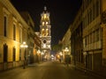 Puebla, Mexico, South America [Town of Puebla at night, street and church decorated with lights]