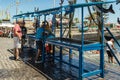 Puerto Cruz, Tenerife, Spain - July 10, 2019: Fisherman after a successful fishing, behind the counter sells his catch of fish and